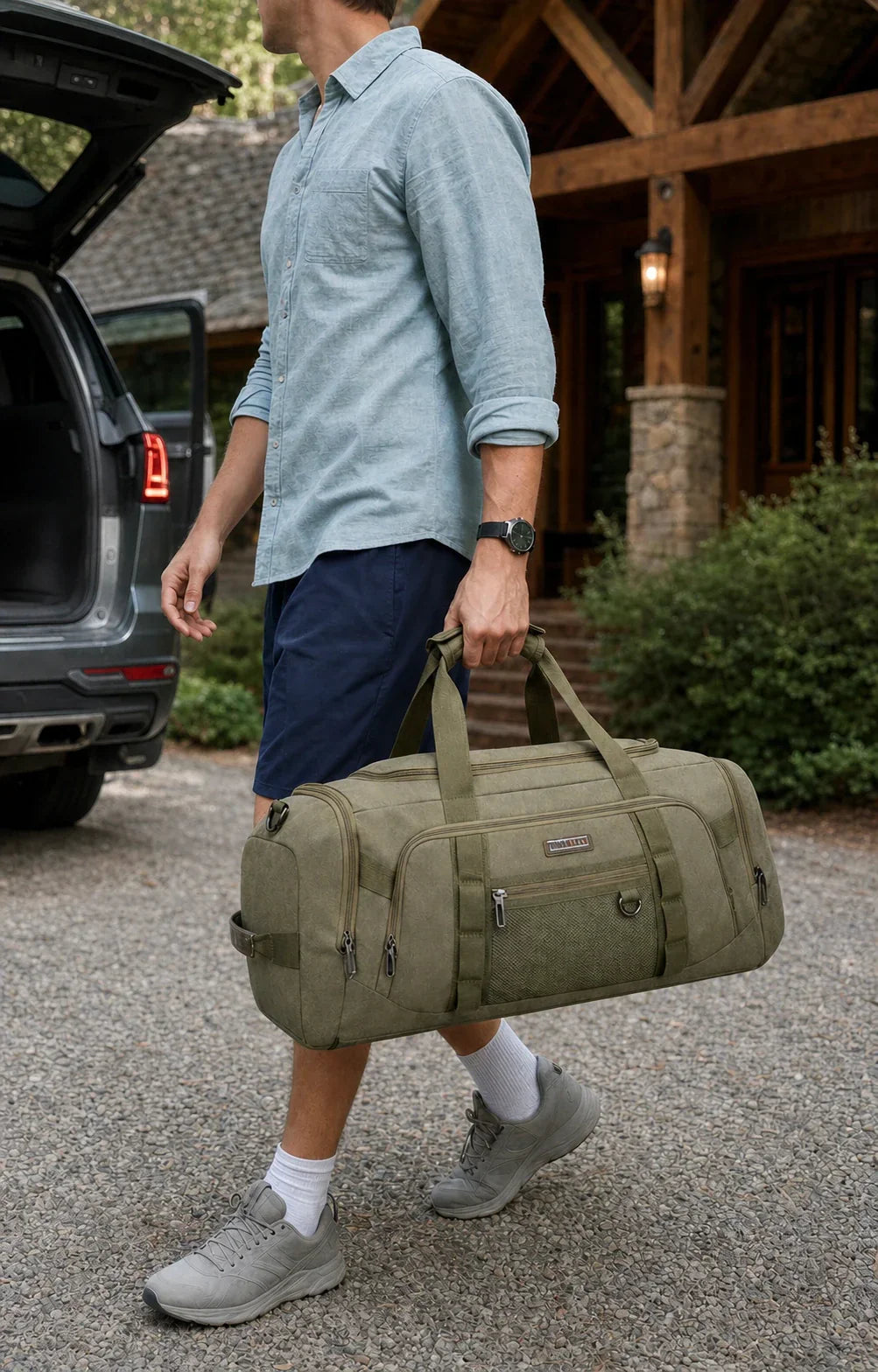 Man carrying a full-size olive WITZMAN A8006-3 45L canvas duffel at a mountain lodge
