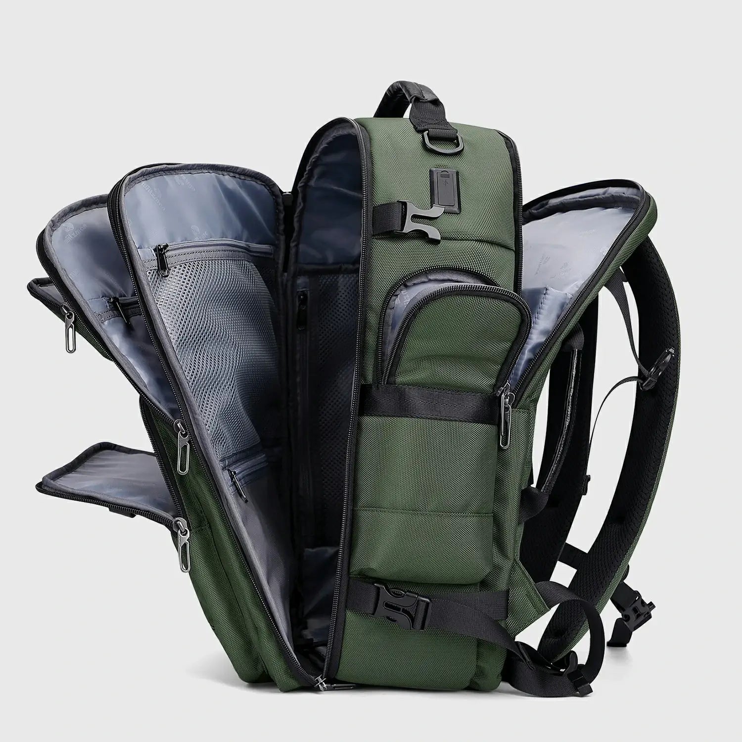 Army green multifunctional travel backpack showing layered compartments and access points