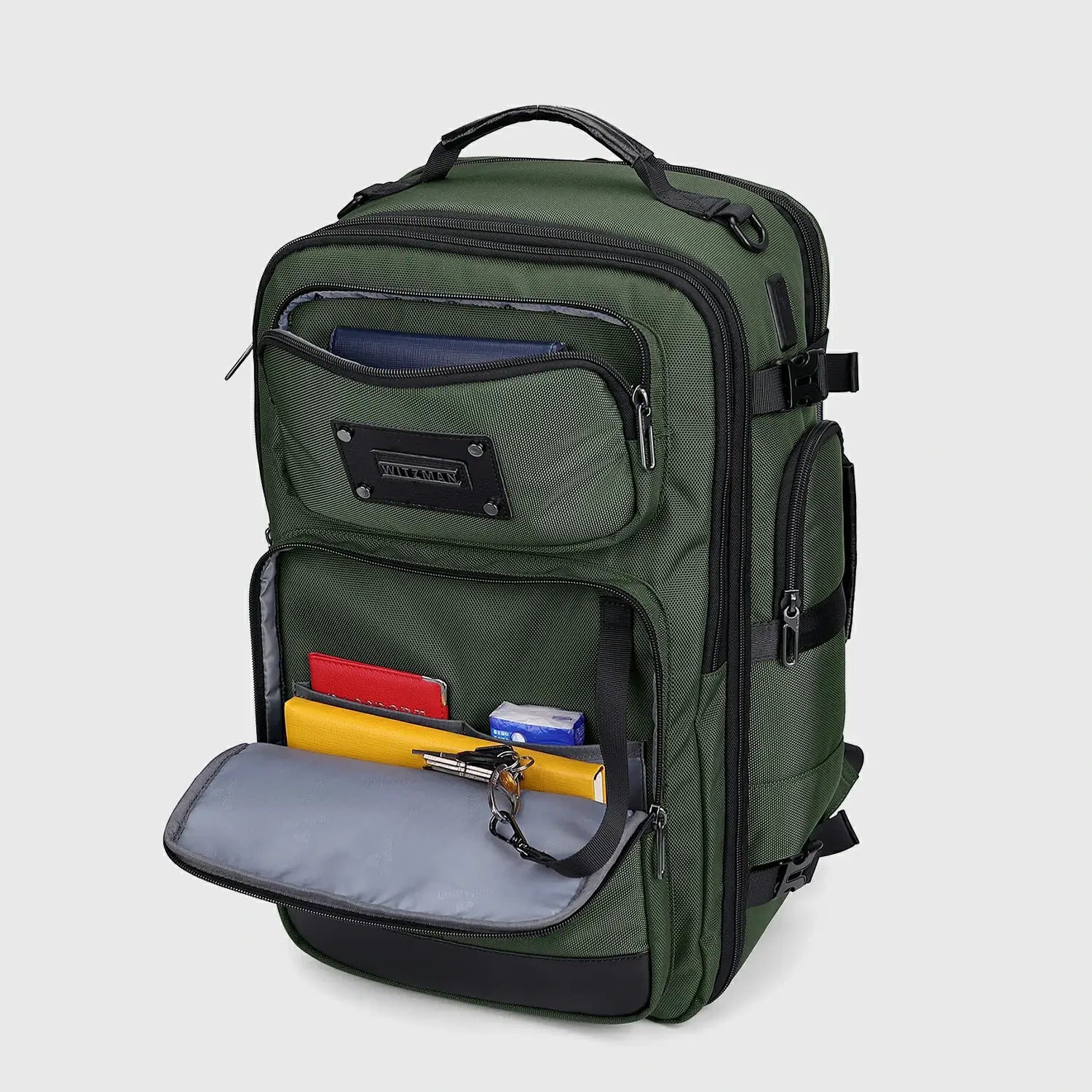 Army green travel backpack with front organizer open for documents, cables and accessories