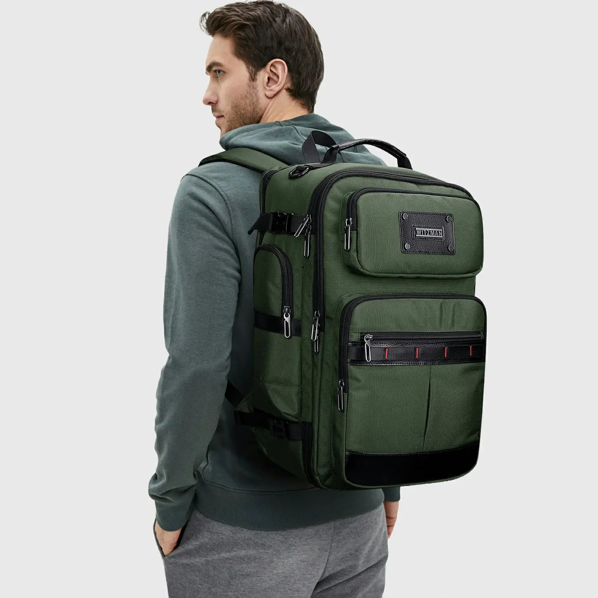 Man wearing army green premium nylon backpack for casual, business and weekend travel