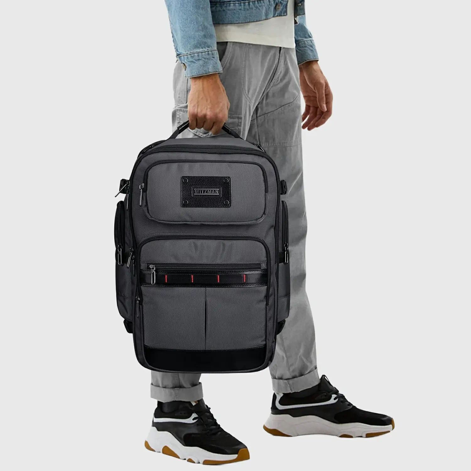 Man wearing WITZMAN silver grey backpack for premium leisure and business travel