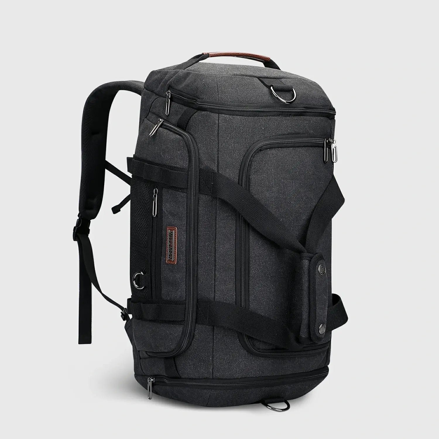 Classic 3-in-1 Canvas Duffel Bag for Travel, model carrying the duffel for scale