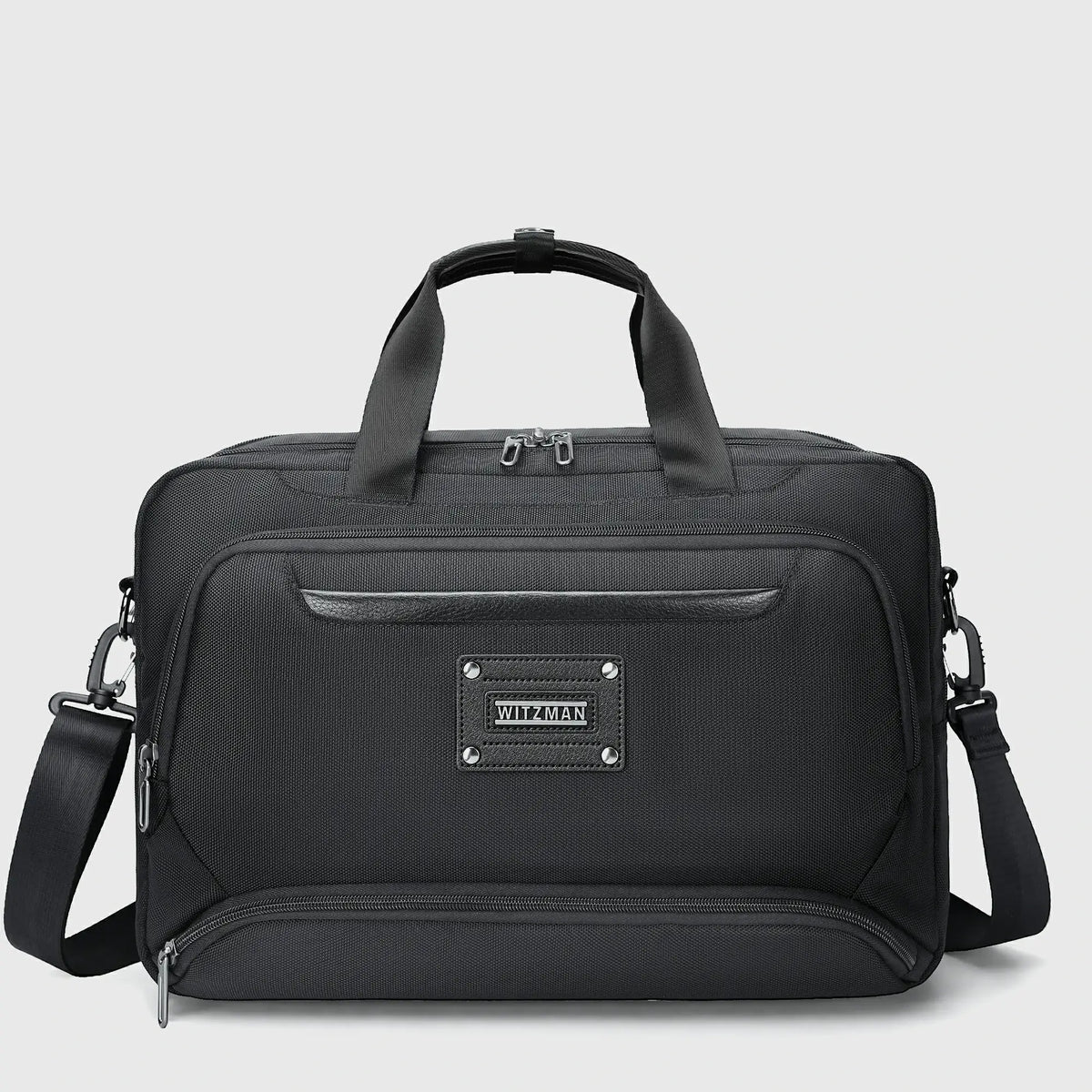 WITZMAN black expandable laptop briefcase for men with nylon exterior, front zipper pockets, and PU leather-wrapped handles