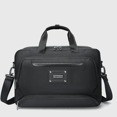 WITZMAN black expandable laptop briefcase for men with nylon exterior, front zipper pockets, and PU leather-wrapped handles