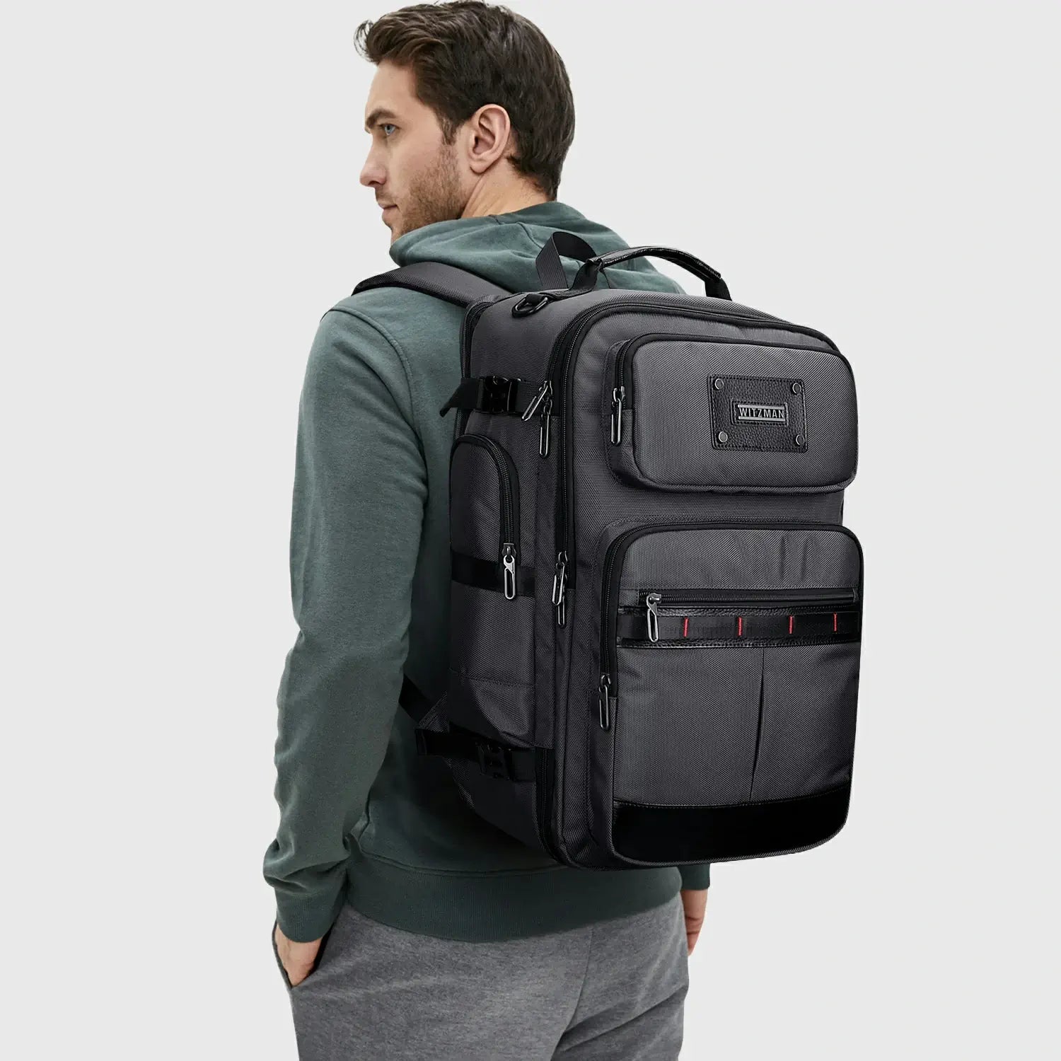 Silver grey premium nylon travel backpack carried by the top handle for short trips