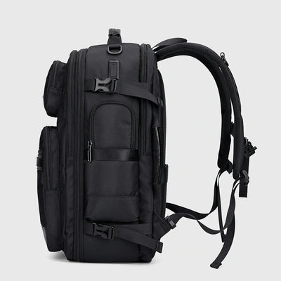 Side view of black premium nylon travel backpack with padded shoulder straps and USB ports