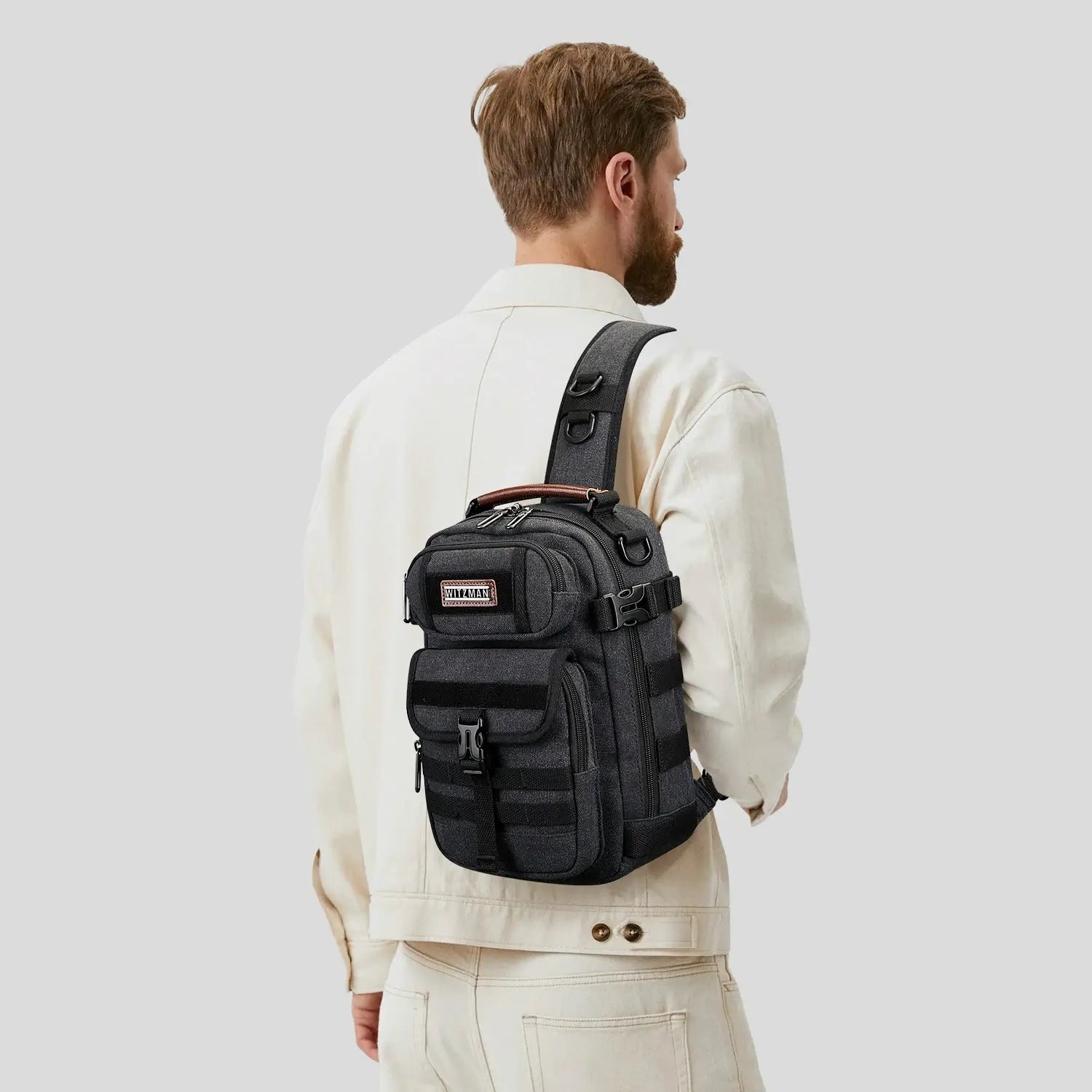 Casual men’s canvas sling bag with tactical webbing, padded iPad sleeve, and anti-theft pocket. Ideal for daily carry, travel, and city commuting.-black bag a8021 witzman