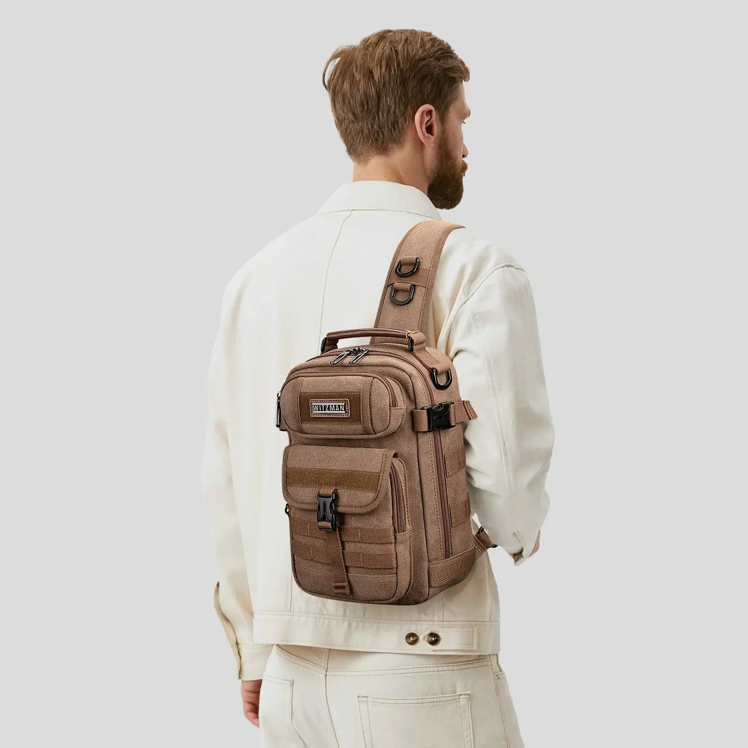 Casual men’s canvas sling bag with tactical webbing, padded iPad sleeve, and anti-theft pocket. Ideal for daily carry, travel, and city commuting.-brown a8021 witzman