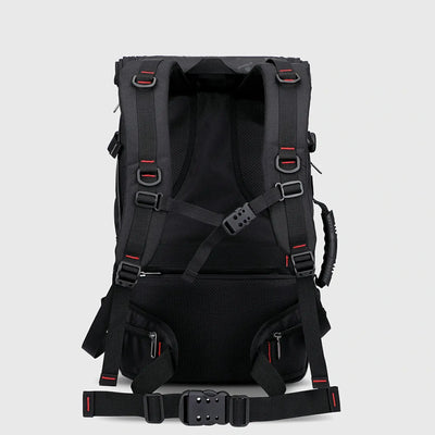 Back view of black travel backpack with padded shoulder straps, chest strap and waist belt