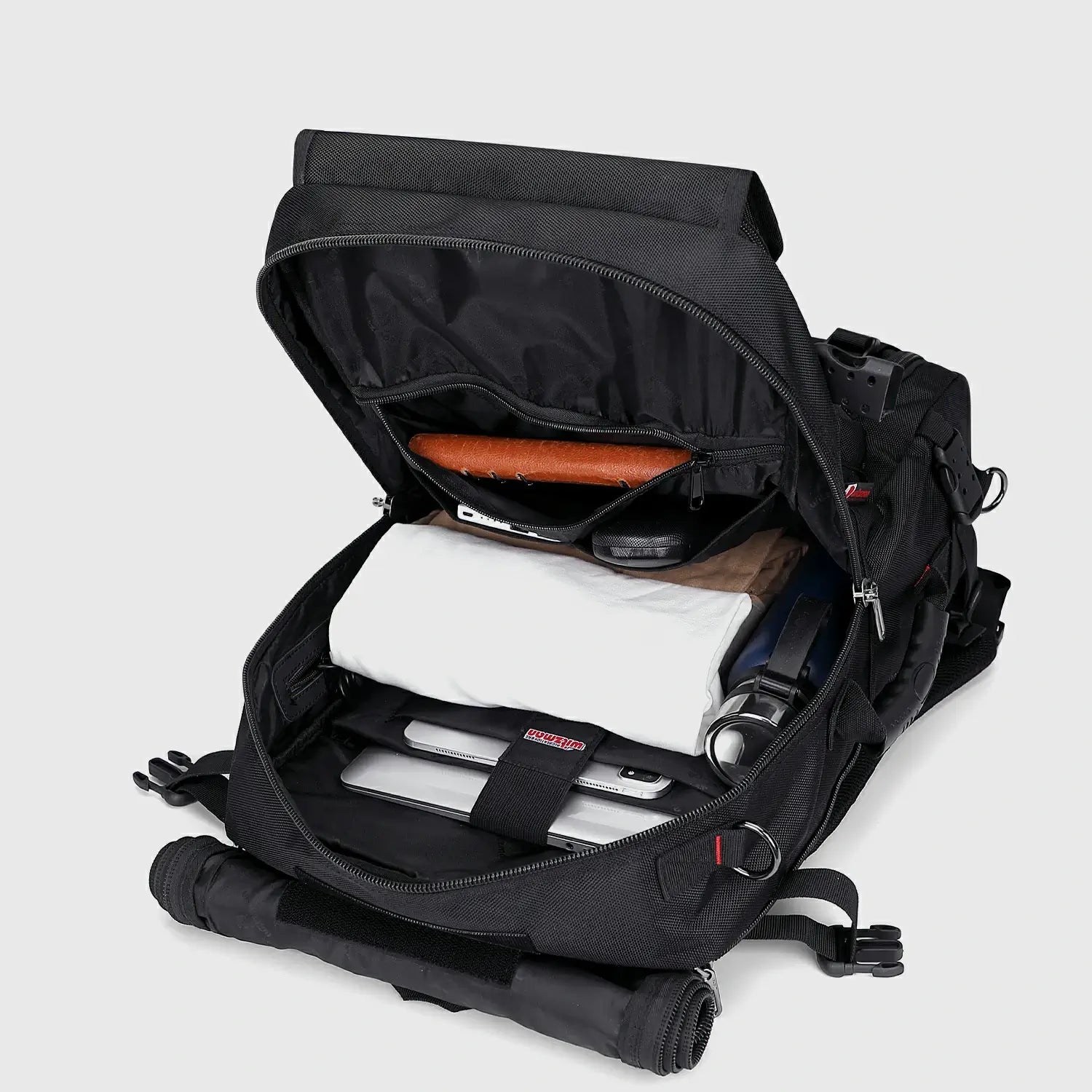 Black nylon carry on backpack with spacious main compartment open for organized packing