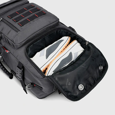 Close-up of separate shoe compartment in silvery grey nylon travel backpack