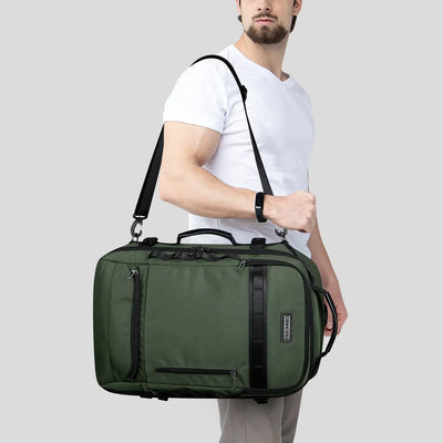 Urban travel backpack for men featuring layered exterior and clean modern styling green should bag
