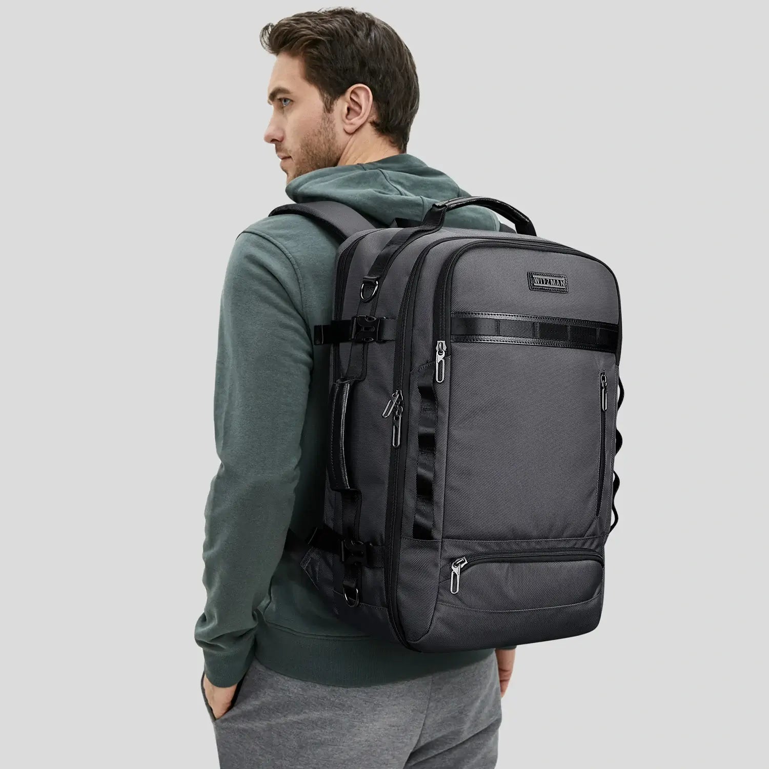 Urban travel backpack for men featuring layered exterior and clean modern styling sliver grey bag