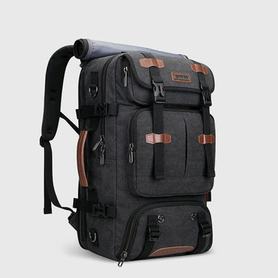 Black canvas carry-on travel backpack for men shown from the front side angle