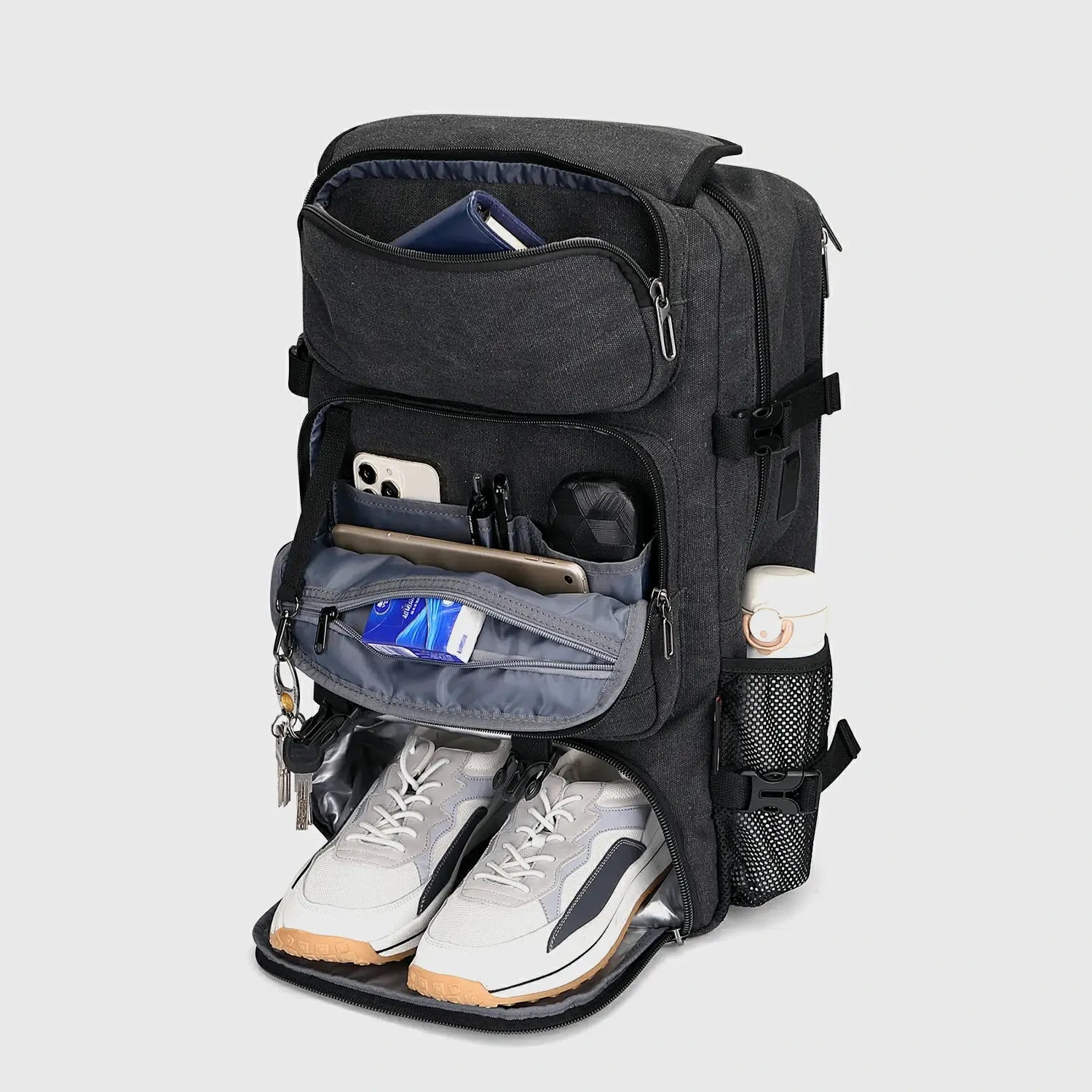 Black carry-on backpack with separate shoe compartment and organized front storage pockets