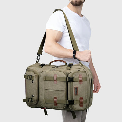 Army green convertible travel backpack carried as a crossbody shoulder bag by a male traveler