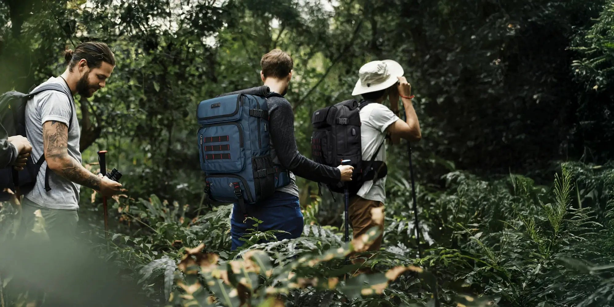 A team traveling outdoors with WITZMAN backpacks