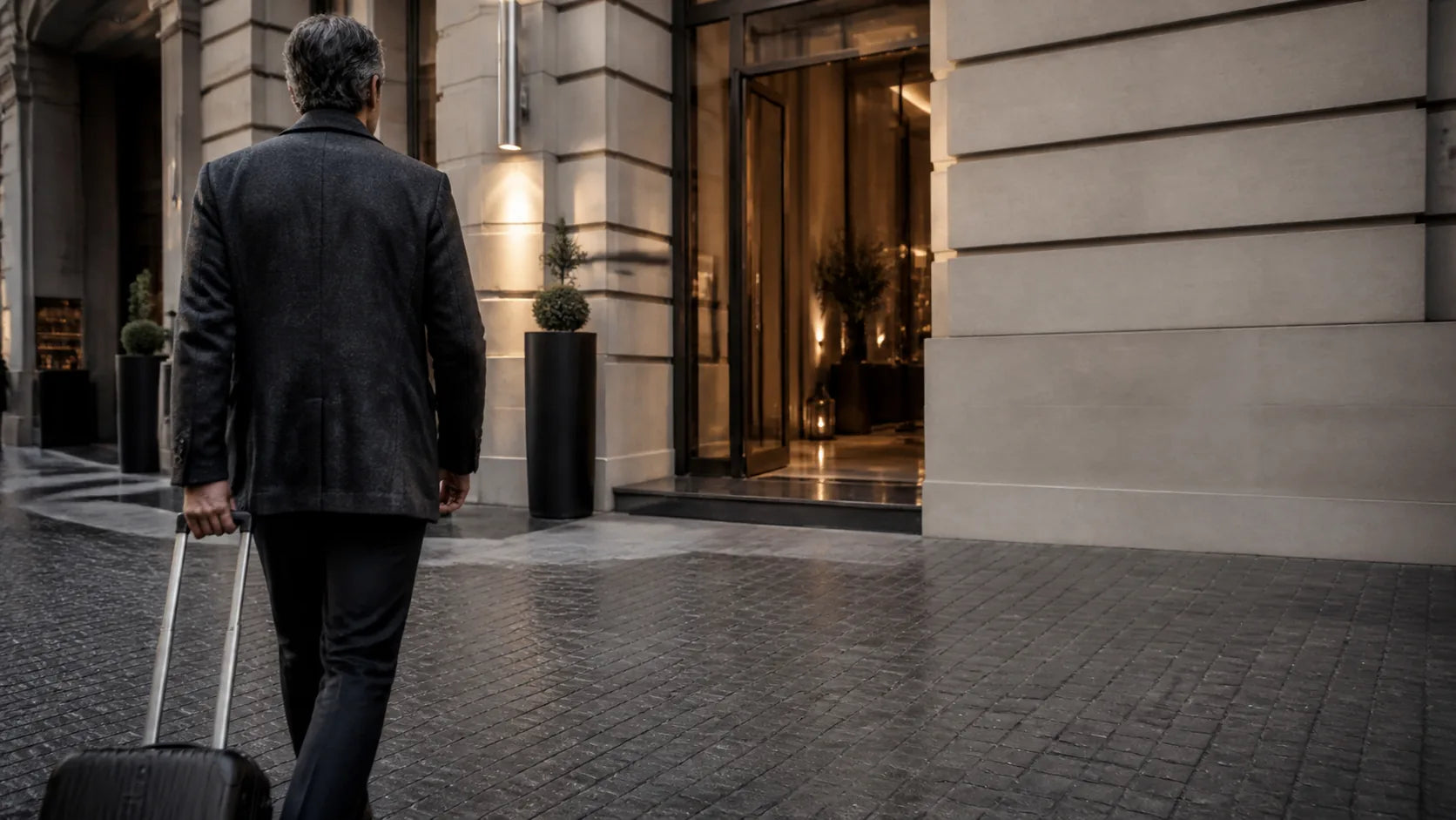 A business traveler arriving at a boutique European hotel